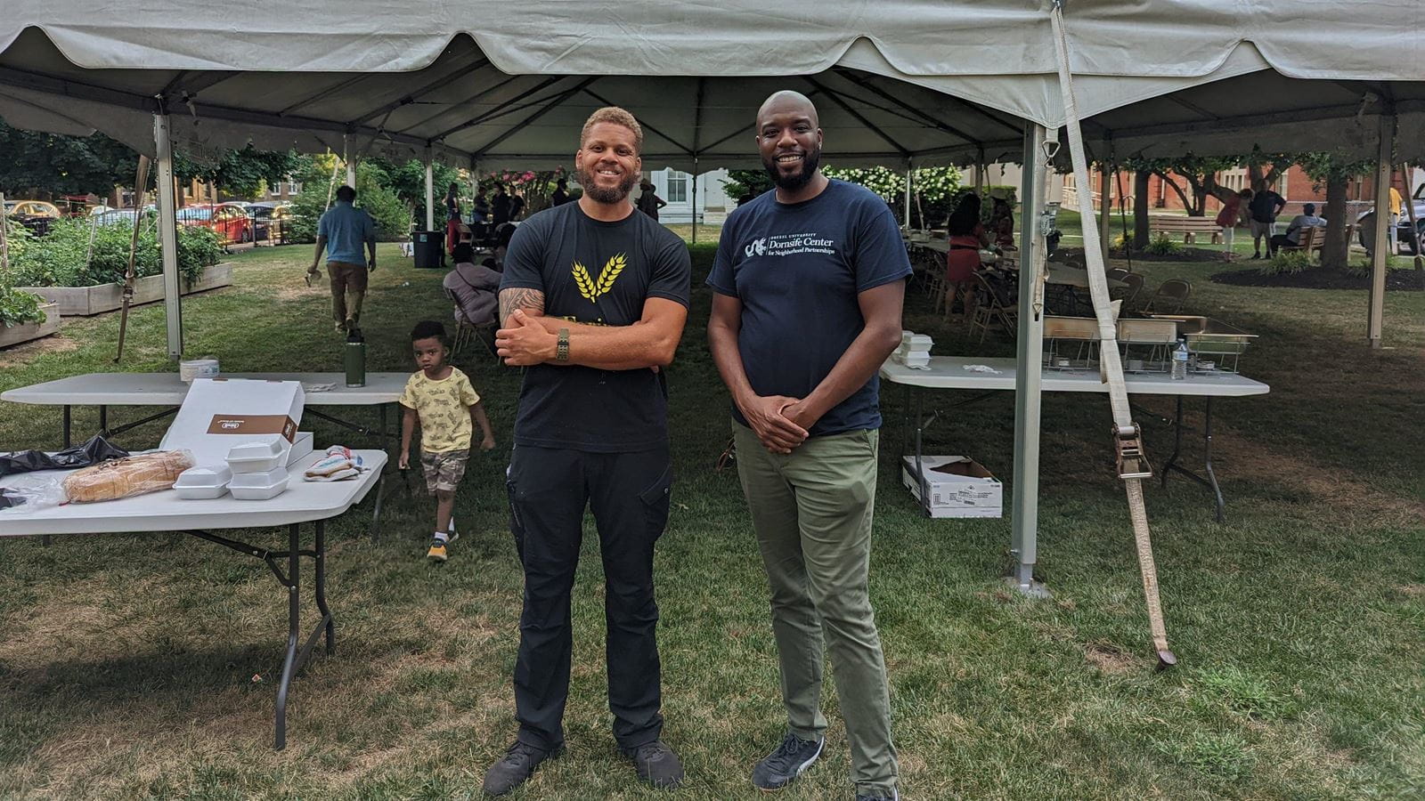 Chef Daniel Lee, BS `18 and Dornsife Center Director John Kirby stood together at the dinner